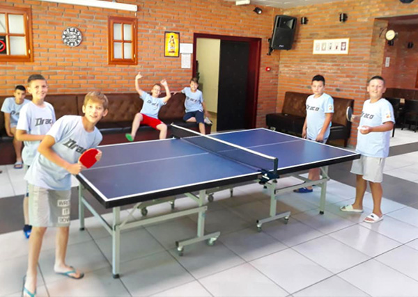 Having fun playing table tennis